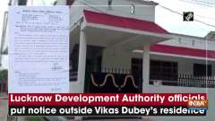 Lucknow Development Authority officials put notice outside Vikas Dubey's residence
