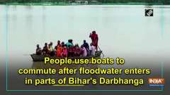 People use boats to commute after floodwater enters in parts of Bihar's Darbhanga