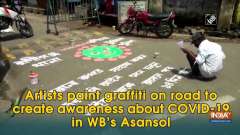 Artists paint graffiti on road to create awareness about COVID-19 in WB's Asansol