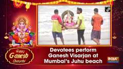 Devotees perform Ganesh Visarjan at Mumbai's Juhu beach