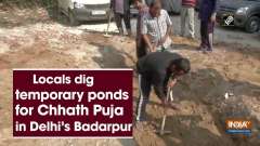 Locals dig temporary ponds for Chhath Puja in Delhi's Badarpur
