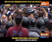 Fans scramble to catch a glimpse of Maradona's coffin