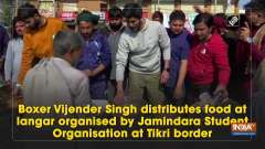 Boxer Vijender Singh distributes food at langar organised by Jamindara Student Organisation at Tikri border