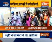  Smriti Irani hits campaign trail in Bengal, rides scooty during BJP roadshow 