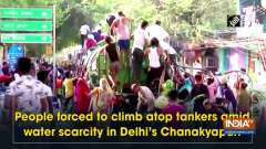 People forced to climb atop tankers amid water scarcity in Delhi's Chanakyapuri