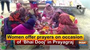 Women offer prayers on occasion of 'Bhai Dooj' in Prayagraj