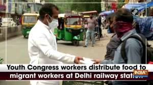Youth Congress workers distribute food to migrant workers at Delhi railway station